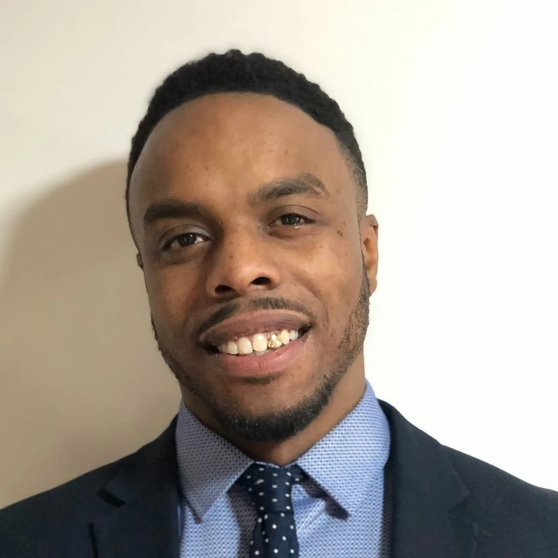 Professional headshot of Isaac Vassell, Founder of Rectify International